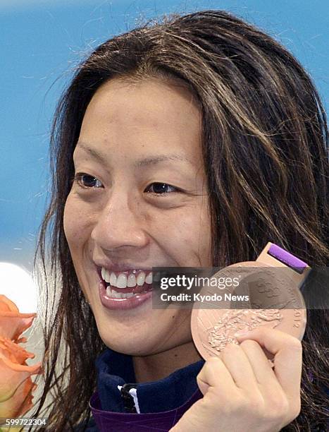 Britain - Japan's Aya Terakawa shows her bronze medal after finishing third in the women's 100-meter backstroke at the 2012 London Olympics at...