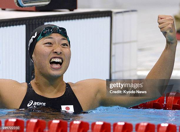 Britain - Japan's Satomi Suzuki celebrates her bronze medal finish in the women's 100-meter breaststroke at the 2012 London Olympics at Aquatics...