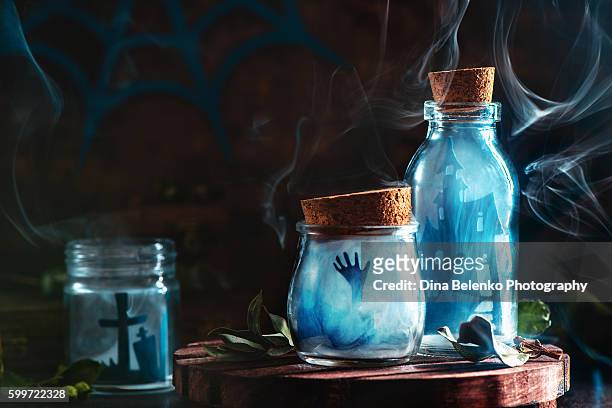 halloween jars with smoke and zombies - crazy holiday models stock pictures, royalty-free photos & images