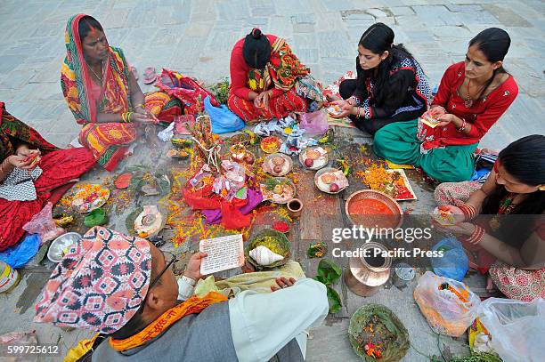 Nepalese devotees offering ritual prayer at the Bank of Bagmati River of Pashupatinath Temple during Rishi Panchami Festival celebrations at...