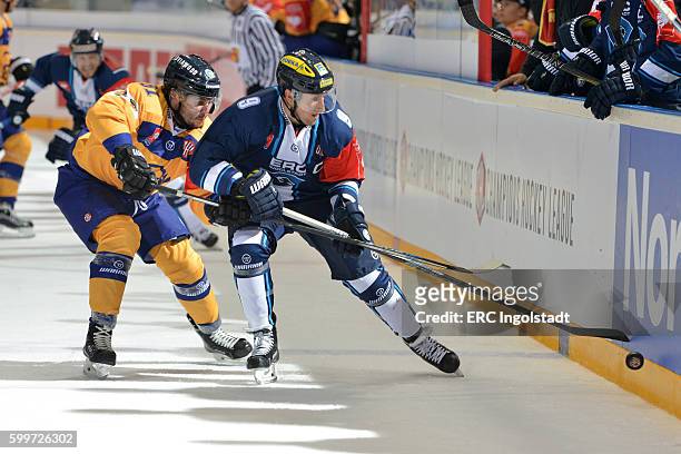 Duel between Brandon Buck and Jesse Virtanen during the Champions Hockey League match between ERC Ingolstadt and Lukko Rauma at Saturn Arena on...