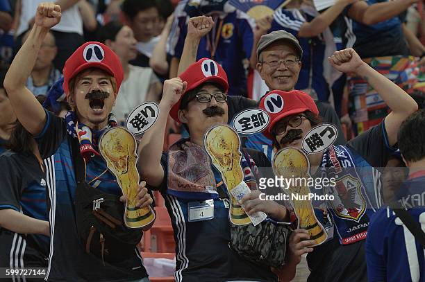 Japan supporters cheer before the 2018 World Cup Qualifiers match between Thailand and Japan at Rajamangala Stadium in Bangkok, Thailand on September...