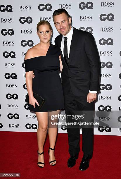 Amy Schumer and Ben Hanisch arrive for GQ Men Of The Year Awards 2016 at Tate Modern on September 6, 2016 in London, England.