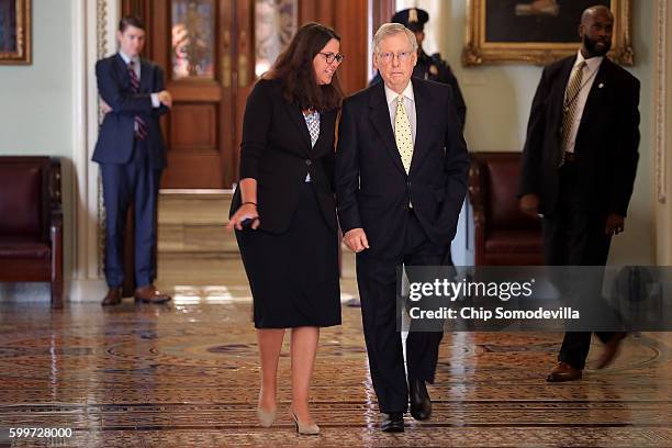 Senate Majority Leader Mitch McConnell walks back to his office with Senate Republican Secretary Laura Dove at the U.S. Capitol September 6, 2016 in...