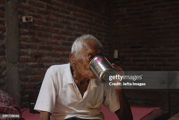 An Indonesian man, named Mbah Gotho, claimed to be 146 years old, is the oldest human in world's history speaks to press members at his family house...