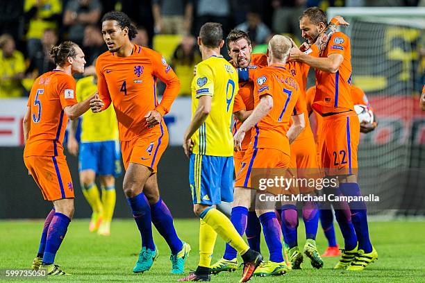 Wesley Sneijder of the Netherlands and teammates celebrate his 1-1 equalizing goal during the 2018 FIFA World Cup Qualifier match between Sweden and...