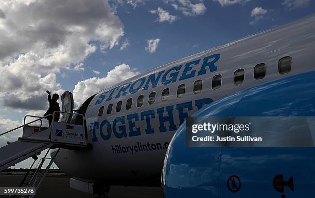 Democratic presidential nominee Hillary Clinton boards her campaign plane at Tampa International Airport on September 6, 2016 in Tampa, Florida...