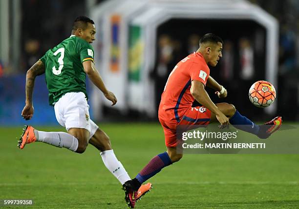 Bolivia's Edemir Rodriguez and Chile's forward Alexis Sanchez vie for the ball during their Russia 2018 FIFA World Cup football qualifier match Chile...