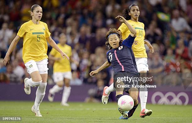 Wales - Japan's Yuki Ogimi scores the team's opening goal during the first half of a women's soccer quarterfinal match against Brazil at Millennium...