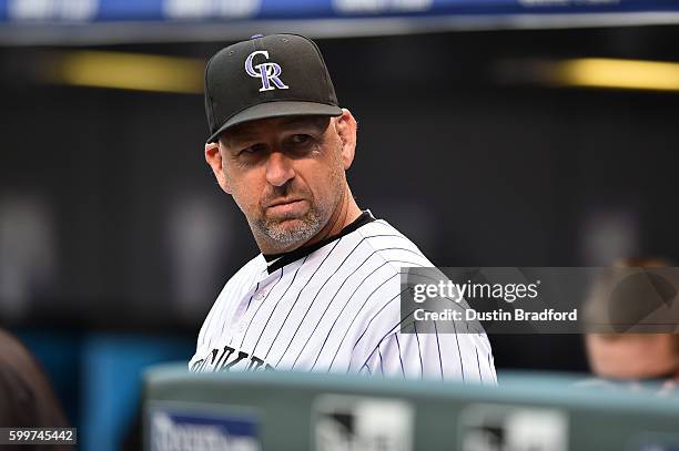 Manager Walt Weiss of the Colorado Rockies looks on from the dugout during a game against the Arizona Diamondbacks at Coors Field on September 3,...