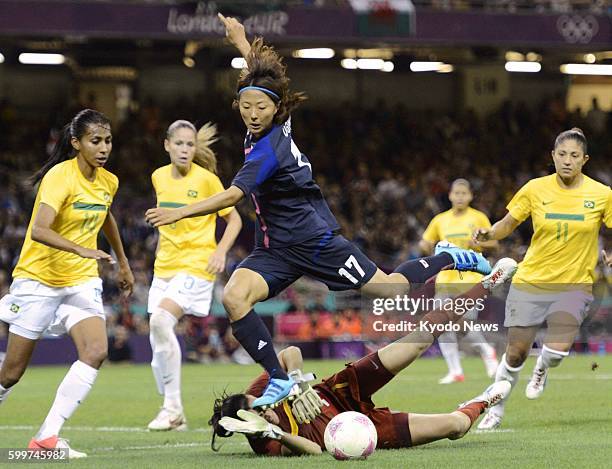 Wales - Japan's Yuki Ogimi attempts to shoot the ball during the second half of a women's soccer quarterfinal match against Brazil at Millennium...