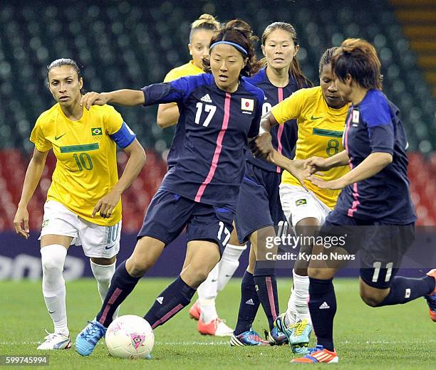 Wales - Japan's Yuki Ogimi dribbles her way during the second half of a women's soccer quarterfinal match against Brazil at Millennium Stadium at the...