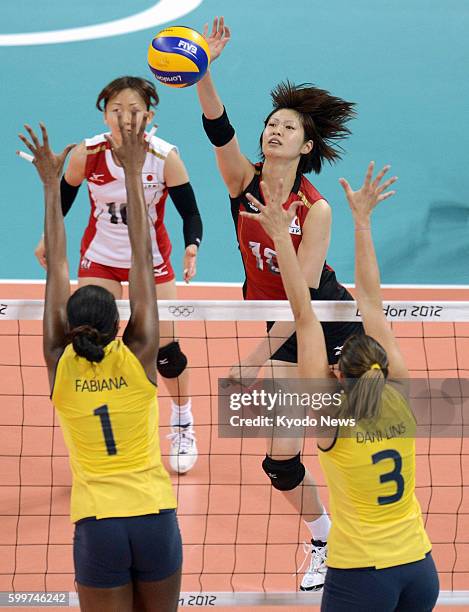 Britain - Japan's Saori Kimura spikes the ball during the first set of a match against Brazil in the women's volleyball semifinals at Earls Court at...