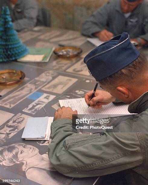 Pilot Col Gene Levy attends an intelligence briefing at Cam Ranh Bay Air Base, Viet Nam, December, 1968.