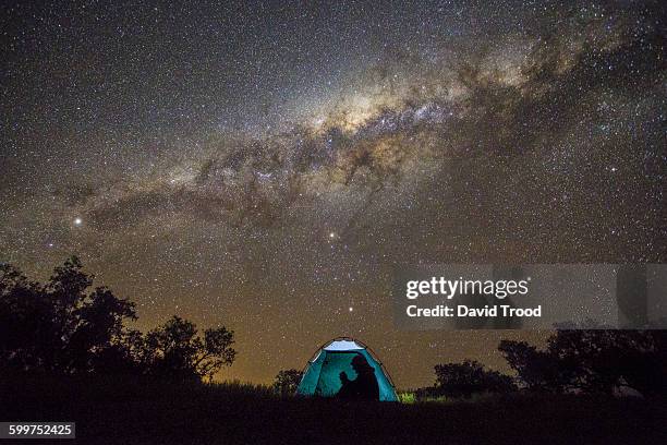 camping under the stars. - tent night stock pictures, royalty-free photos & images