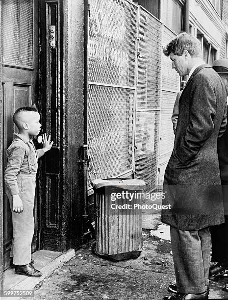 Senator Robert Kennedy discusses school with young boy, New York, February 4, 1966.