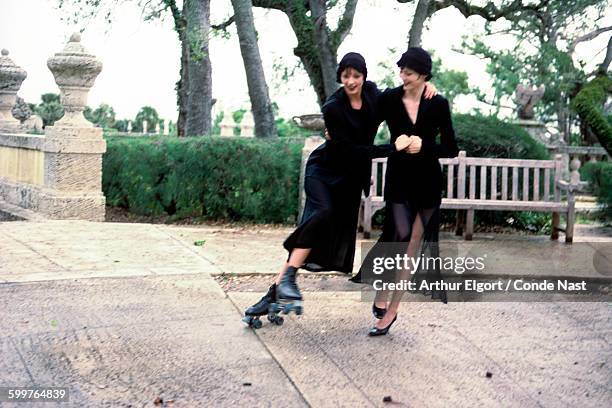 Models Patricia Hartmann and Janine Giddings wearing Helmut Lang's black jackets over chiffon dresses by Anna Sui. CREDIT MUST READ: Arthur...