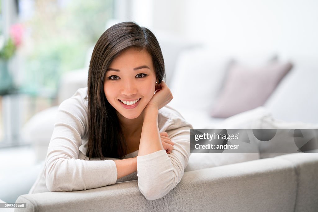 Beautiful Asian woman at home