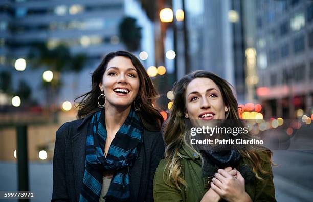 girls having fun - city dusk stock pictures, royalty-free photos & images