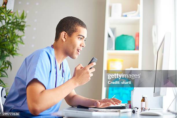 medical student working at his desk - electronic medical record stock pictures, royalty-free photos & images