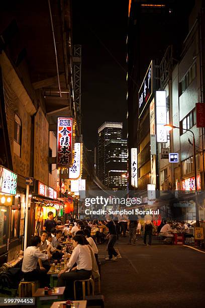 street by yurakucho yakitori alley - yurakucho stock pictures, royalty-free photos & images