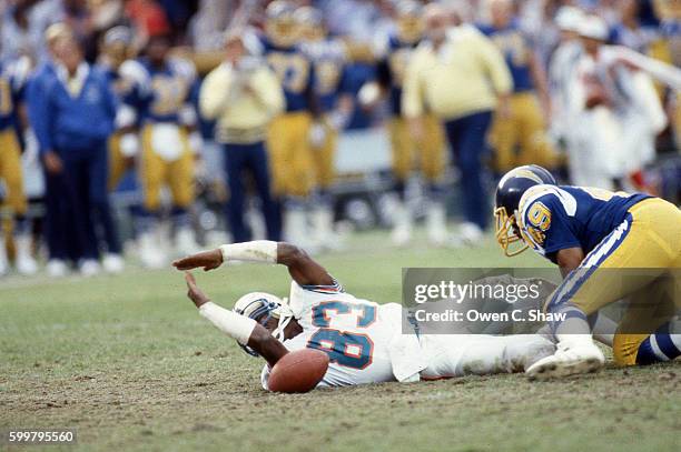 Mark Clayton of the Miami Dolphins circa 1984 calls for a time out against the San Diego Chargers at Jack Murphy Stadium in San Diego, California.