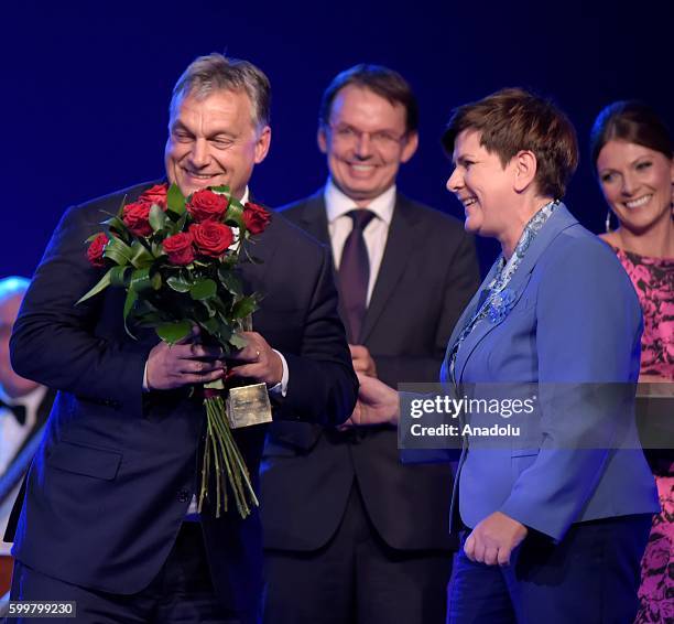 TThhe Polish Prime Ministe, Beata Szydo delivers the prize to the Hungarian Prime Minister,Viktor Orban witch has been award as Men of the Year by...