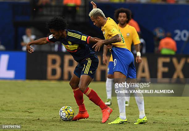 Brazil's Neymar Jr and Colombia's midfielder Juan Cuadrado vie for the ball during their Russia 2018 FIFA World Cup football qualifier match Brazil...