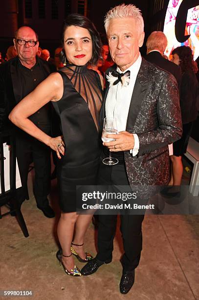 Mariana De Carvalho and Adam Clayton attend the GQ Men Of The Year Awards 2016 after party at the Tate Modern on September 6, 2016 in London, England.