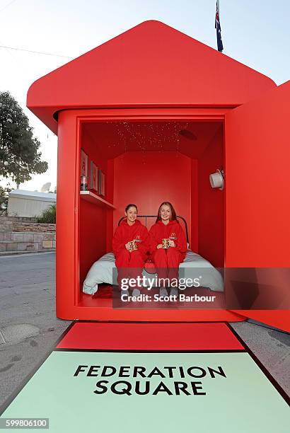 McDonalds super-fans Laura Paton and Emma Kendrick relax in McDonalds Monopoly Hotel at Federation Square on September 7, 2016 in Melbourne,...