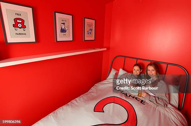 McDonalds super-fans Laura Paton and Emma Kendrick relax in McDonalds Monopoly Hotel at Federation Square on September 7, 2016 in Melbourne,...