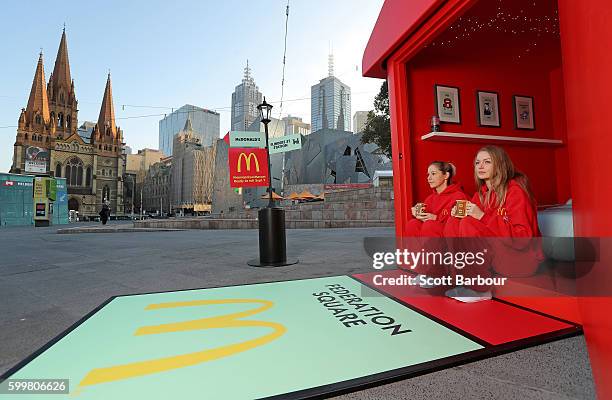 McDonalds super-fans Laura Paton and Emma Kendrick relax in McDonalds Monopoly Hotel at Federation Square on September 7, 2016 in Melbourne,...