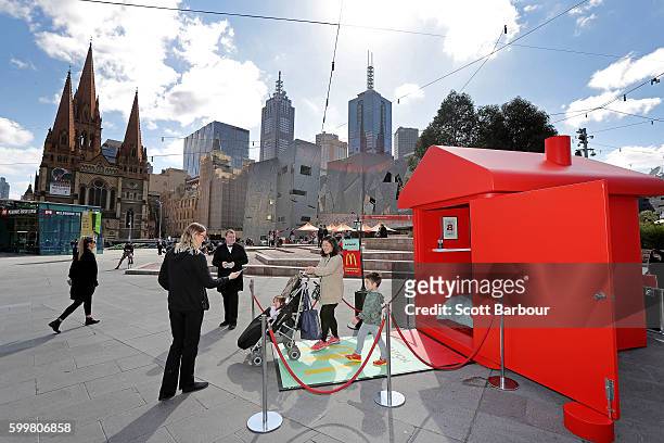 People visit McDonalds Monopoly Hotel at Federation Square on September 7, 2016 in Melbourne, Australia. Built to celebrate the return of the...