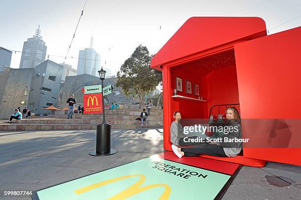 McDonalds super-fans Laura Paton and Emma Kendrick relax in McDonalds Monopoly Hotel at Federation Square on September 7, 2016 in Melbourne,...