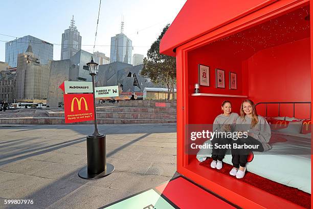 McDonalds super-fans Laura Paton and Emma Kendrick relax in McDonalds Monopoly Hotel at Federation Square on September 7, 2016 in Melbourne,...