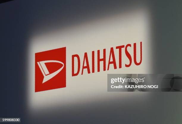 The logo of the Daihatsu Motor is displayed at a press preview to announce its new passenger car in Tokyo on September 7, 2016.