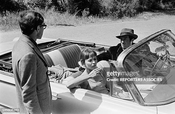 Director Jean-Luc Godard With Anna Karina And Jean-Paul Belmondo On The Set Of The Movie 'Pierrot Le Fou' Directed By Jean-Luc Godard, in Hyères,...