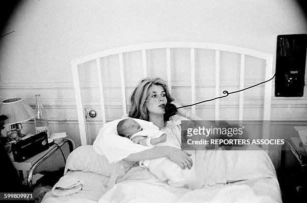 Actress Catherine Deneuve with Her Newborn Child Christian Vadim at the Clinic in Paris, France, in June 1963 .