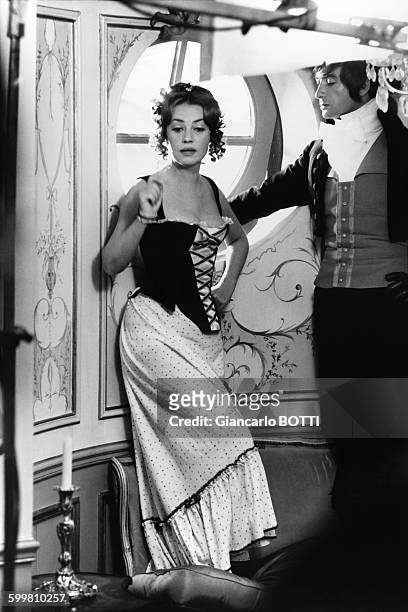 French actress Jeanne Moreau with male counterpart Jean-Claude Brialy on the set of the comedy film 'The Oldest Profession' , directed by Philippe de...