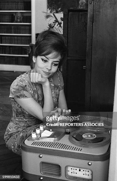 French Actress Michèle Mercier at Home in Paris, France, on April 16, 1964 .