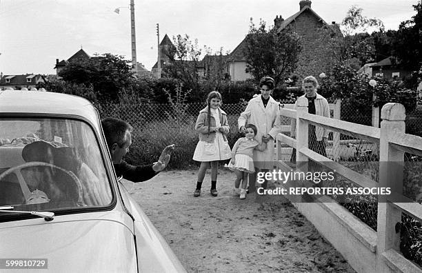 Man Saying Goodbye to His Family While Leaving His Home in the Small Norman City of Ouistreham, France, on June 24, 1963 .