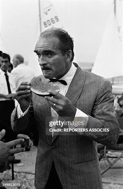 Eddie Barclay Eating Watermelon at a Beach Party in Cannes, France, in 1960 .