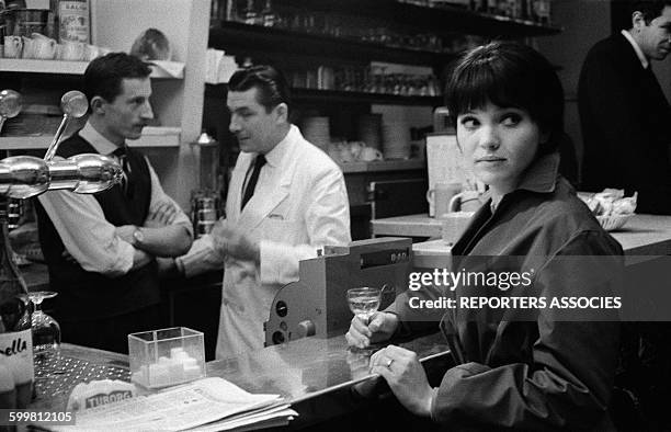 Actress Anna Karina in a Bar in Paris, France, in 1960 .