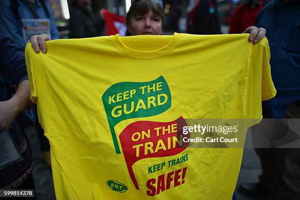 Woman holds a T-shirt as she joins Southern Rail employees in a strike against company working practices on September 7, 2016 in London, England....