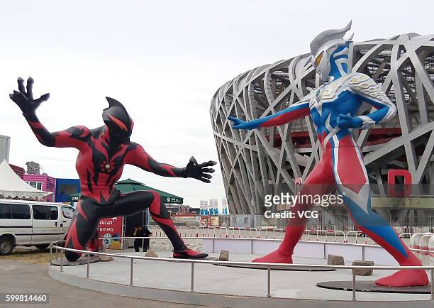 The sculptures of a 5-meter-tall superhero "Ultraman" and a monster Belial beside the National Stadium on September 6, 2016 in Beijing, China. The...