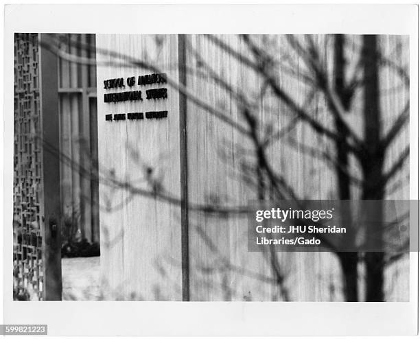 Advanced International Studies, School of exterior, entrance with building sign, 1965.