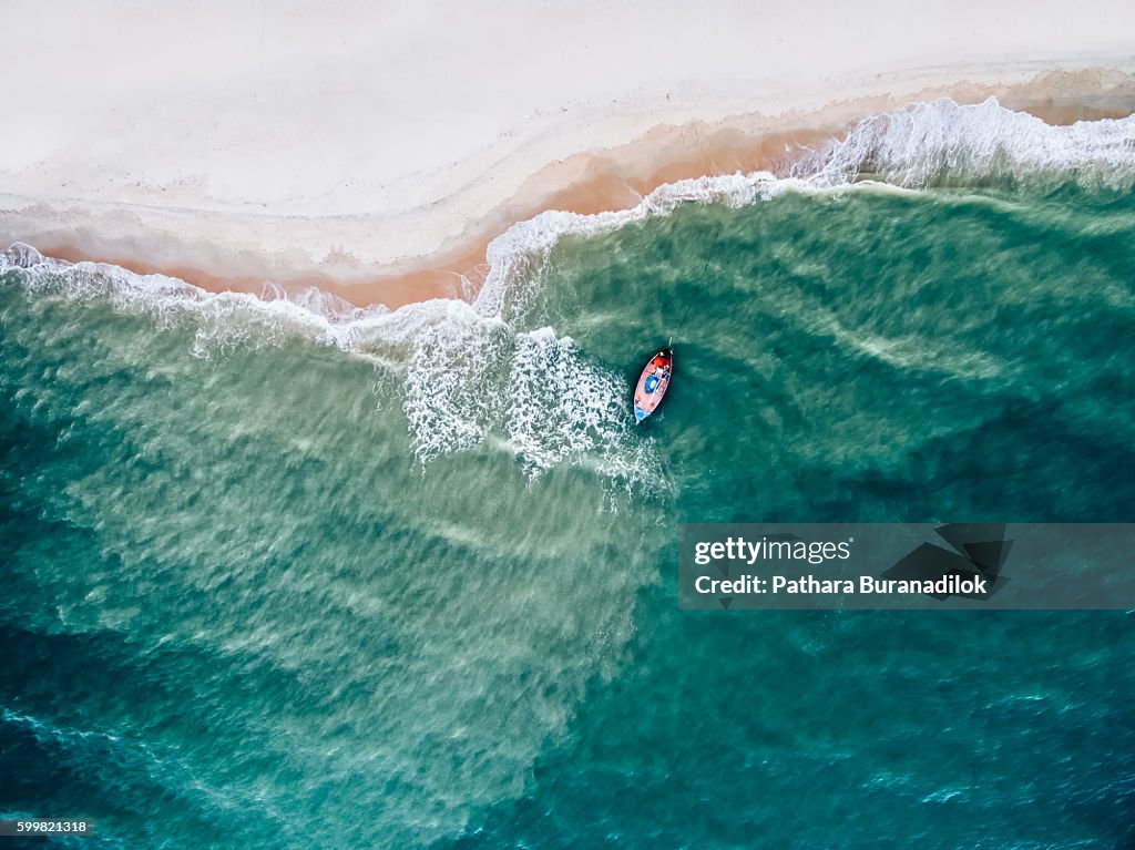 Top view of a fishing boat at the beach