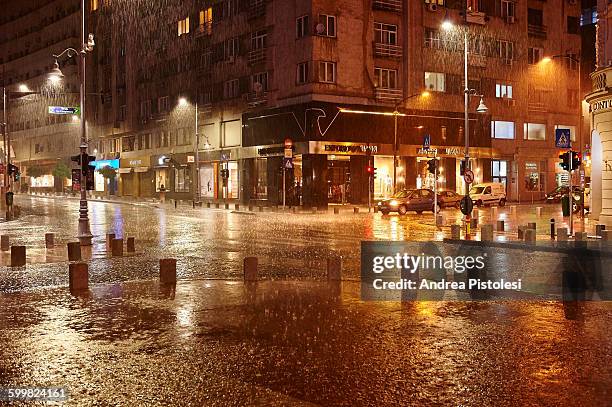 rainy night in bucharest, romania - bucarest foto e immagini stock