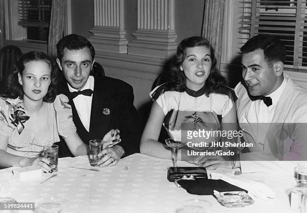 Student Life, Senior Banquet and Dance, Ira Singer, Theodore DeBois, Ira Singer and Ted DeBois sitting at a table with their dates during the Senior...