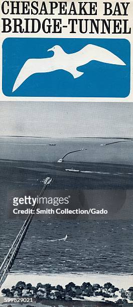 Chesapeake Bay Bridge Tunnel, travel brochure with image of the bridge and tunnel taken from the shore, boats passing by the bridge, Maryland, 1963.